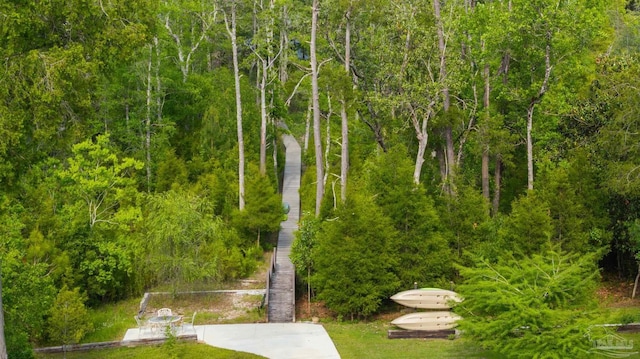 surrounding community featuring a view of trees