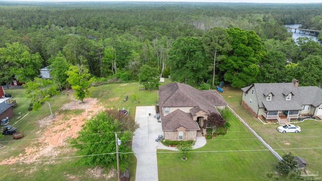 drone / aerial view featuring a view of trees