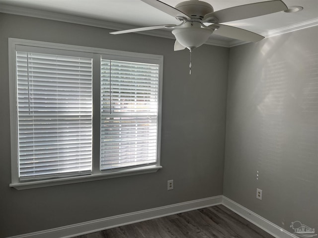 empty room featuring crown molding, dark hardwood / wood-style floors, and ceiling fan