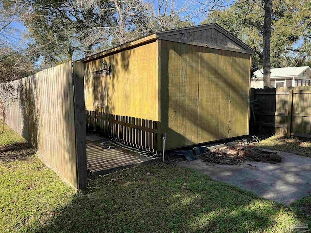 view of outbuilding with a lawn