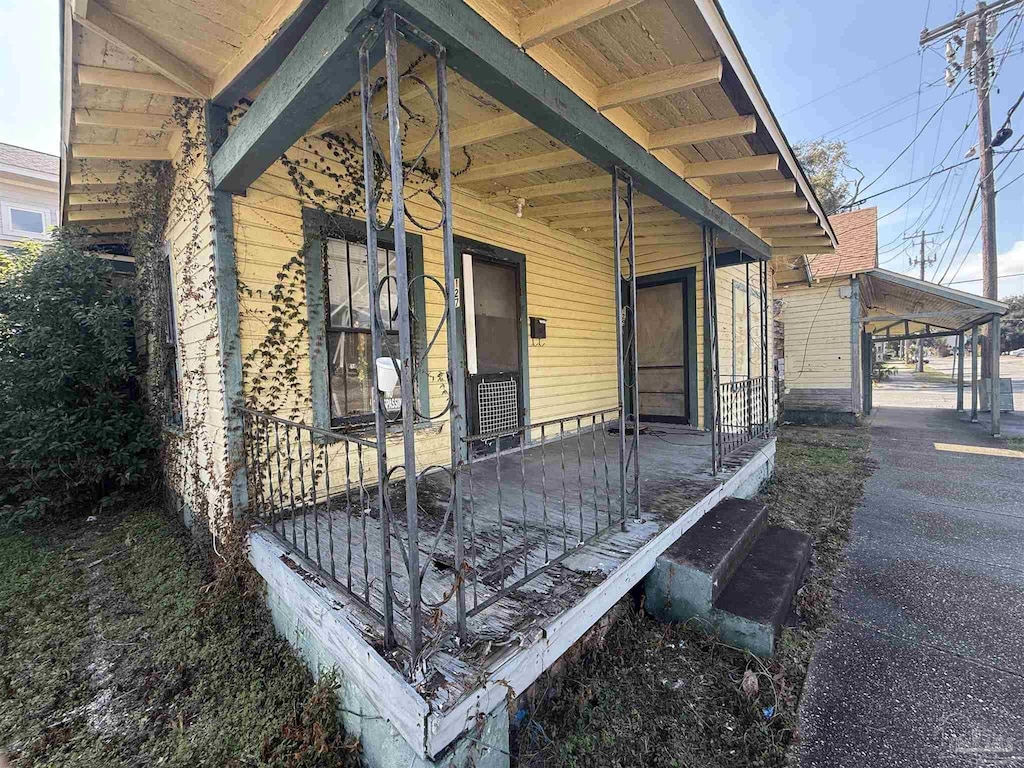 entrance to property with covered porch