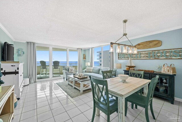 dining room featuring ornamental molding, light tile patterned flooring, a textured ceiling, and floor to ceiling windows