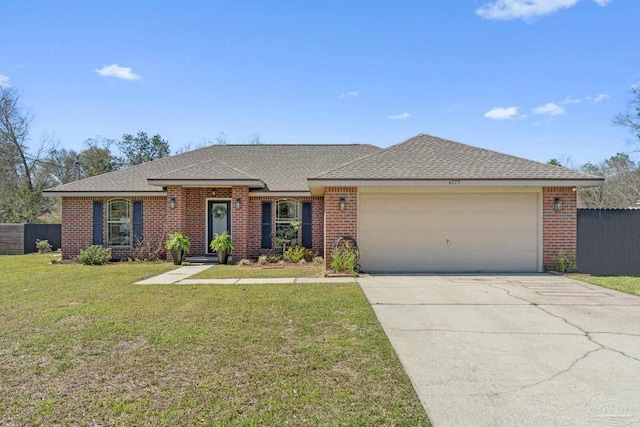 single story home featuring driveway, fence, a front yard, an attached garage, and brick siding