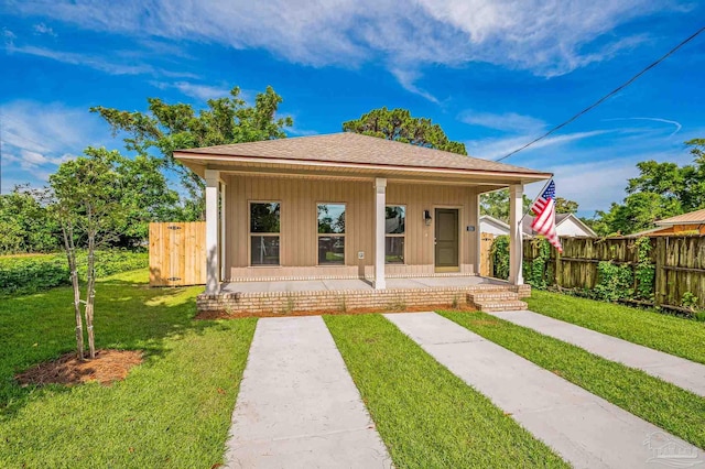520 K St, Pensacola, FL 32501 - view of front facade featuring board and batten siding and roof with shingles