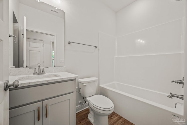520 K St, Pensacola, FL 32501 - full bath featuring toilet, wood finished floors, vanity, and  shower combination