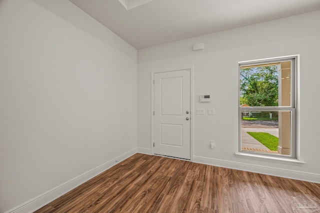 520 K St, Pensacola, FL 32501 - unfurnished room with dark wood-style floors and baseboards