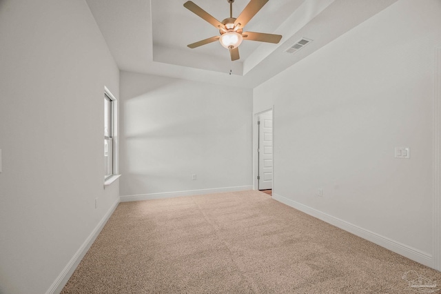 520 K St, Pensacola, FL 32501 - carpeted spare room featuring ceiling fan, baseboards, and a raised ceiling