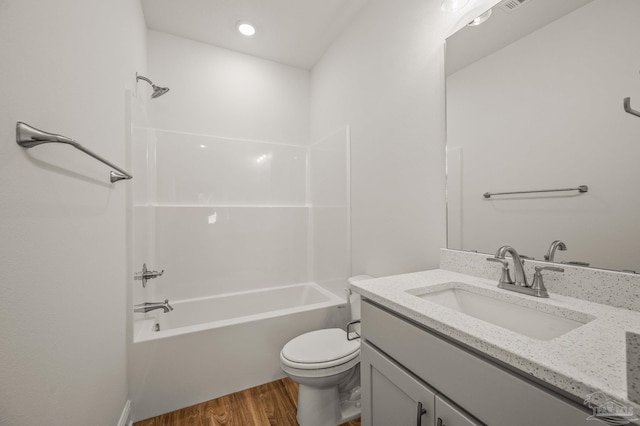 520 K St, Pensacola, FL 32501 - full bathroom featuring vanity, wood finished floors, toilet, and bathing tub / shower combination