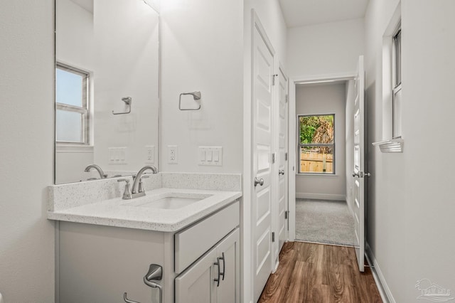 520 K St, Pensacola, FL 32501 - bathroom featuring vanity, wood finished floors, and baseboards