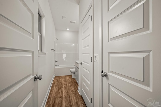 520 K St, Pensacola, FL 32501 - full bathroom with wood finished floors, toilet,  shower combination, and recessed lighting