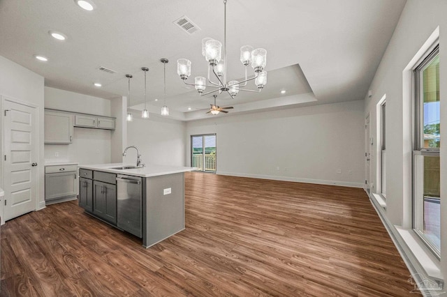 520 K St, Pensacola, FL 32501 - kitchen with stainless steel dishwasher, gray cabinets, a sink, ceiling fan, and dark wood-style floors