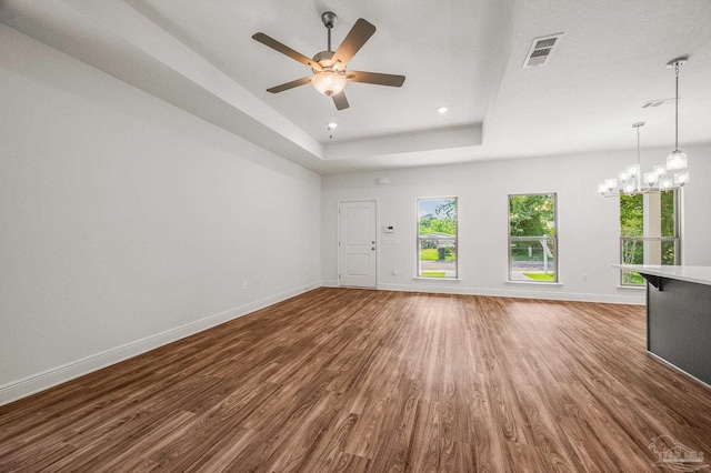 520 K St, Pensacola, FL 32501 - unfurnished living room with wood finished floors, baseboards, a ceiling fan, a chandelier, and recessed lighting