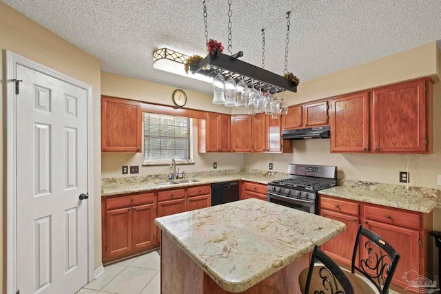 kitchen with sink, black dishwasher, stainless steel gas range oven, a textured ceiling, and a kitchen island