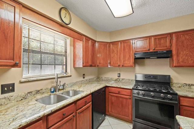 kitchen featuring sink, black dishwasher, stainless steel gas range oven, a textured ceiling, and light tile patterned floors