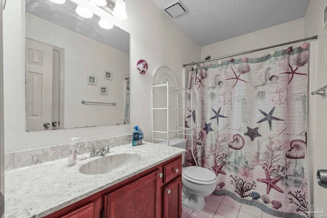 bathroom featuring walk in shower, vanity, a textured ceiling, tile patterned flooring, and toilet