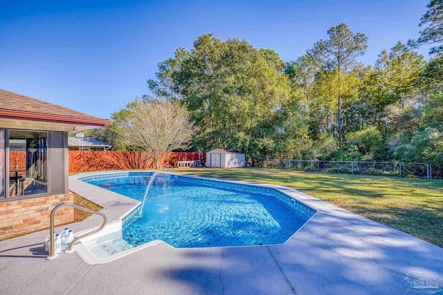 view of pool with a lawn and a shed