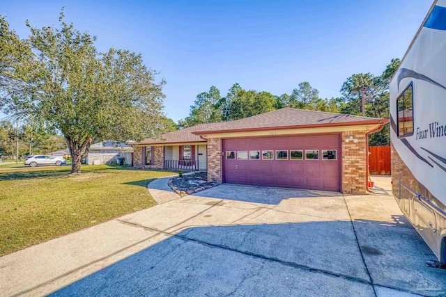 view of front of house featuring a garage and a front lawn