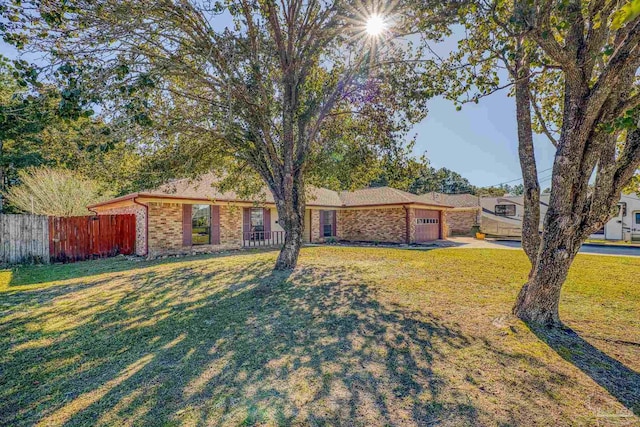 ranch-style house with a front lawn and a garage