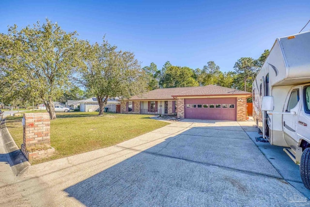 view of front of house featuring a garage and a front lawn