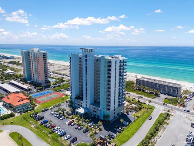 bird's eye view featuring a water view and a view of the beach