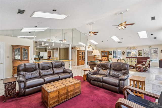 living area with billiards, vaulted ceiling with skylight, tile patterned flooring, and visible vents