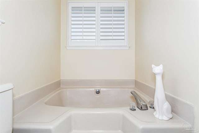 full bath with a garden tub