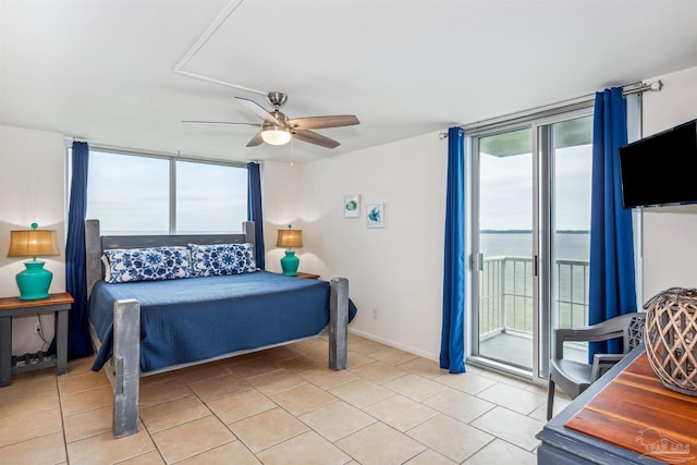 tiled bedroom with ceiling fan and access to exterior