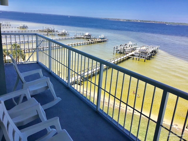 balcony featuring a water view