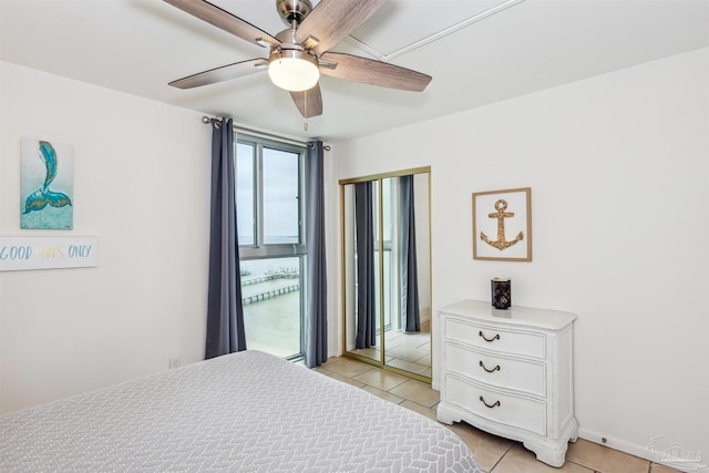 bedroom featuring ceiling fan and light tile patterned floors