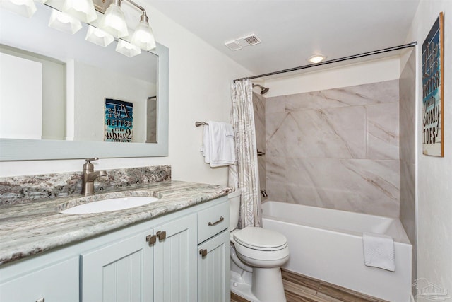 full bathroom featuring shower / tub combo with curtain, hardwood / wood-style floors, vanity, and toilet