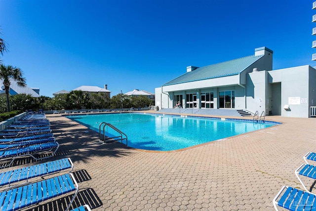 view of pool featuring a patio