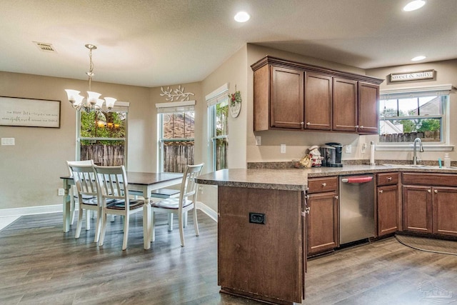 kitchen with plenty of natural light, dark hardwood / wood-style floors, and sink