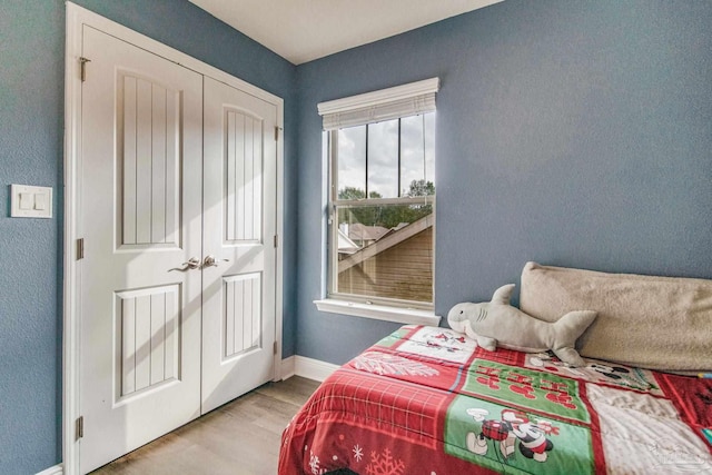 bedroom featuring a closet and light hardwood / wood-style floors