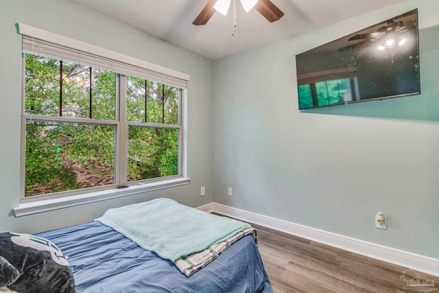 bedroom featuring ceiling fan and wood-type flooring