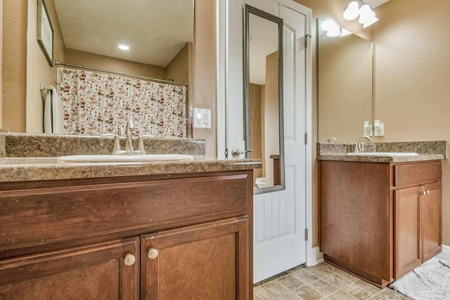 bathroom with a shower with curtain and vanity