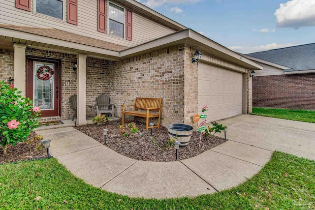 doorway to property with a garage