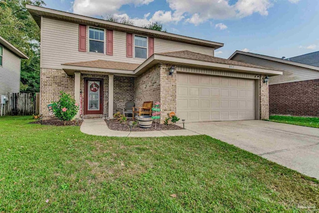 view of front of home with a front yard and a garage