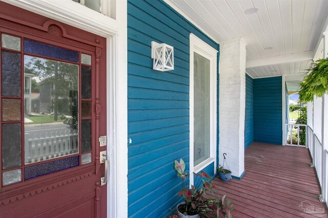 view of side of home with covered porch