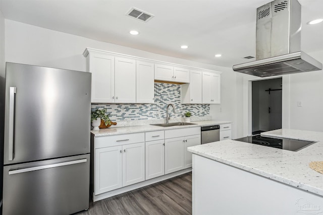 kitchen with tasteful backsplash, island exhaust hood, sink, dark wood-type flooring, and appliances with stainless steel finishes