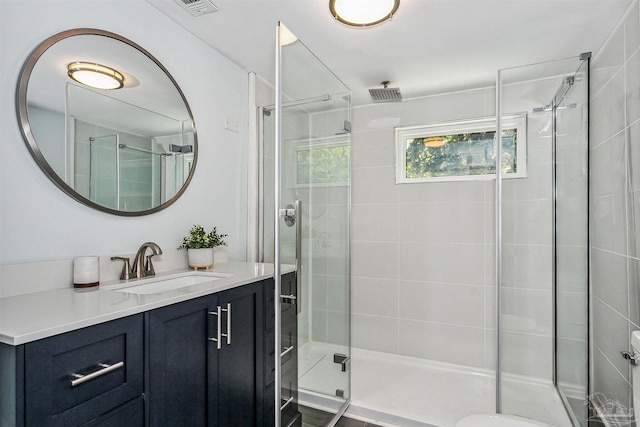 bathroom featuring vanity and walk in shower