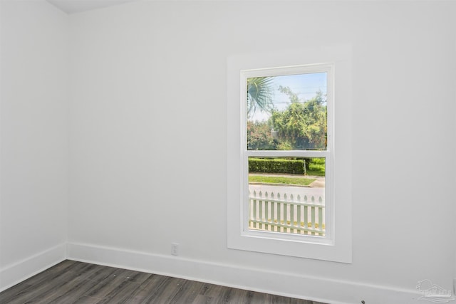 empty room with dark hardwood / wood-style floors