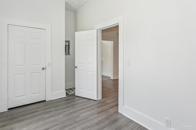 spare room featuring light hardwood / wood-style floors