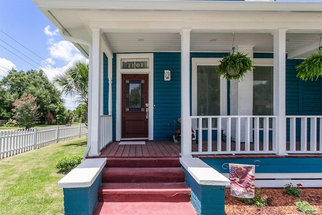 view of exterior entry featuring a porch