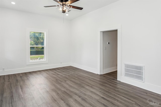 empty room featuring ceiling fan and dark hardwood / wood-style flooring