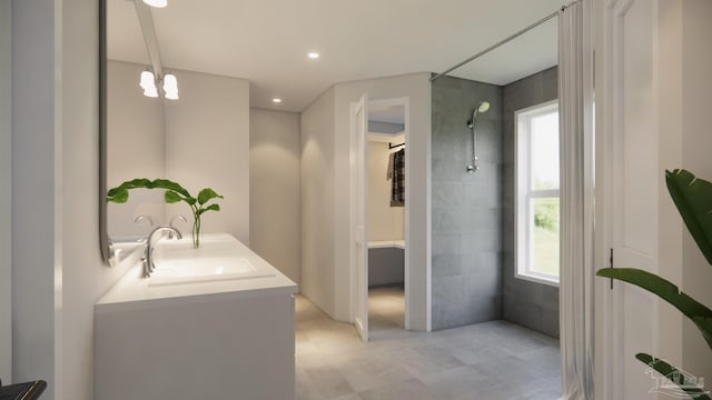 bathroom with vanity and a tile shower