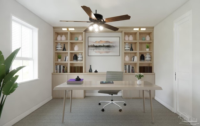 home office featuring ceiling fan, a healthy amount of sunlight, and carpet floors