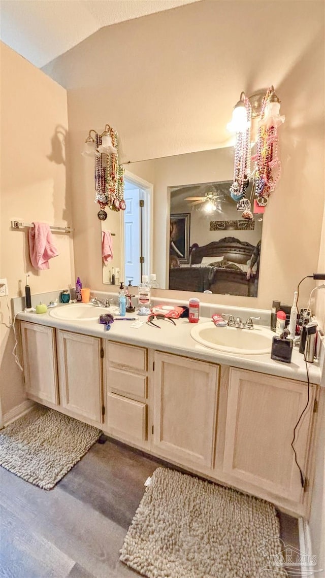 kitchen featuring dishwasher, a center island, sink, refrigerator with ice dispenser, and a textured ceiling