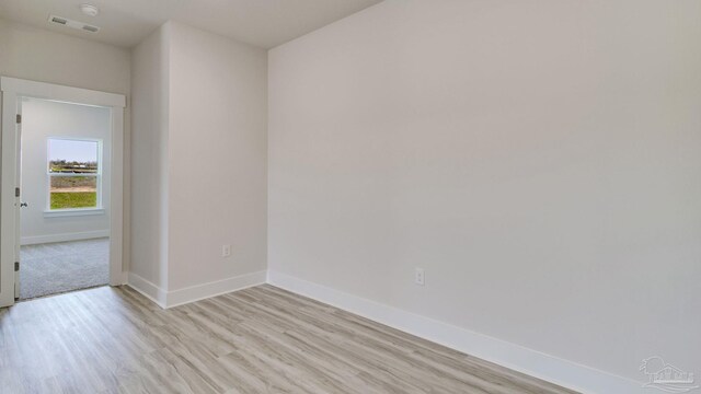 2733 Chevy Cir, Pace, FL 32571 - spare room with light wood-type flooring and baseboards