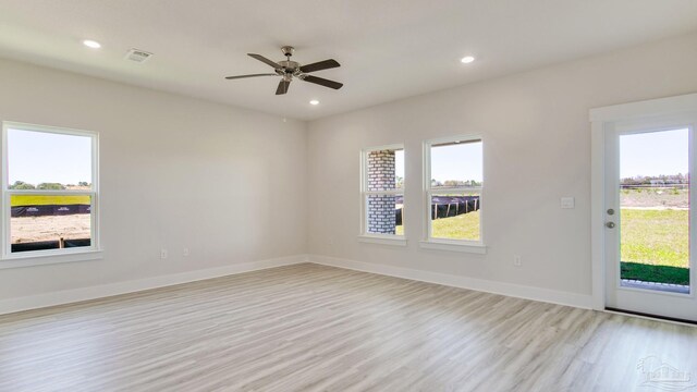 2733 Chevy Cir, Pace, FL 32571 - spare room with light wood-style floors, healthy amount of natural light, baseboards, a ceiling fan, and recessed lighting