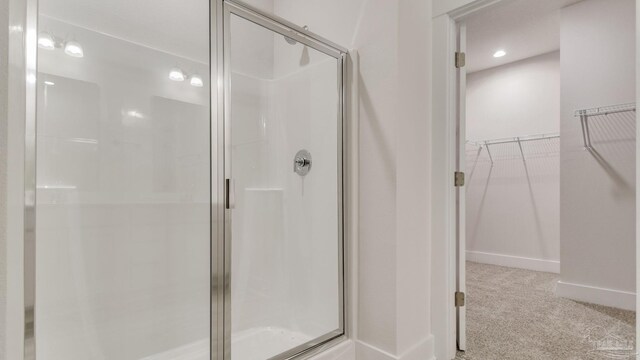 2733 Chevy Cir, Pace, FL 32571 - bathroom featuring a stall shower, baseboards, a spacious closet, and recessed lighting